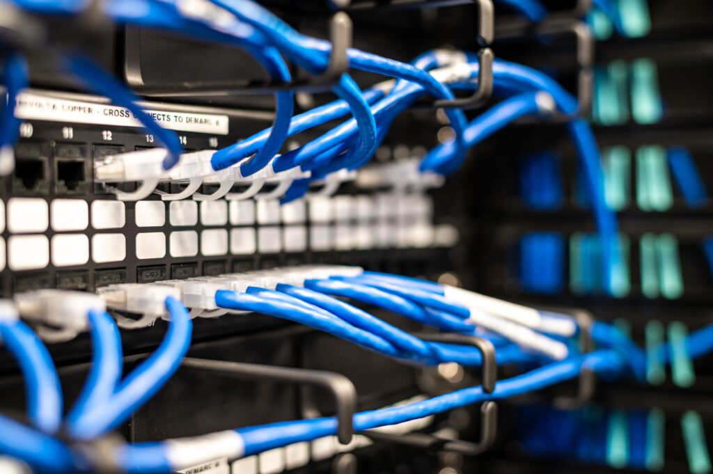 pexels-photo-4716292-4716292 Blue plastic wires with white tips connected to server and provide access to information